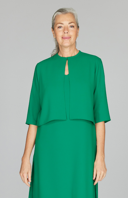 Fabienne is wearing Bottle Green in size XS.